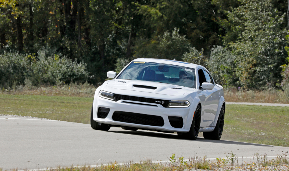 image of white car in Evaluation and Hadling Road