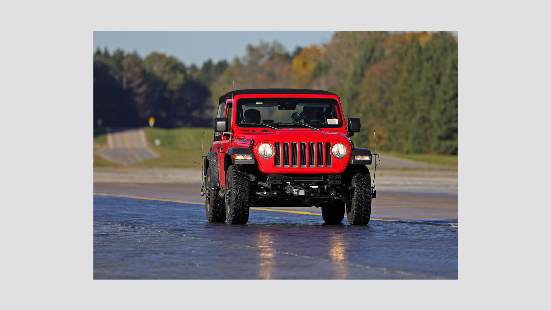 Image of a red Jeep on Skid Traction